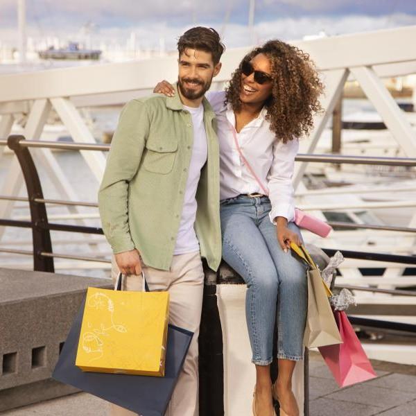 Couple with shopping bags at Gunwharf Quays